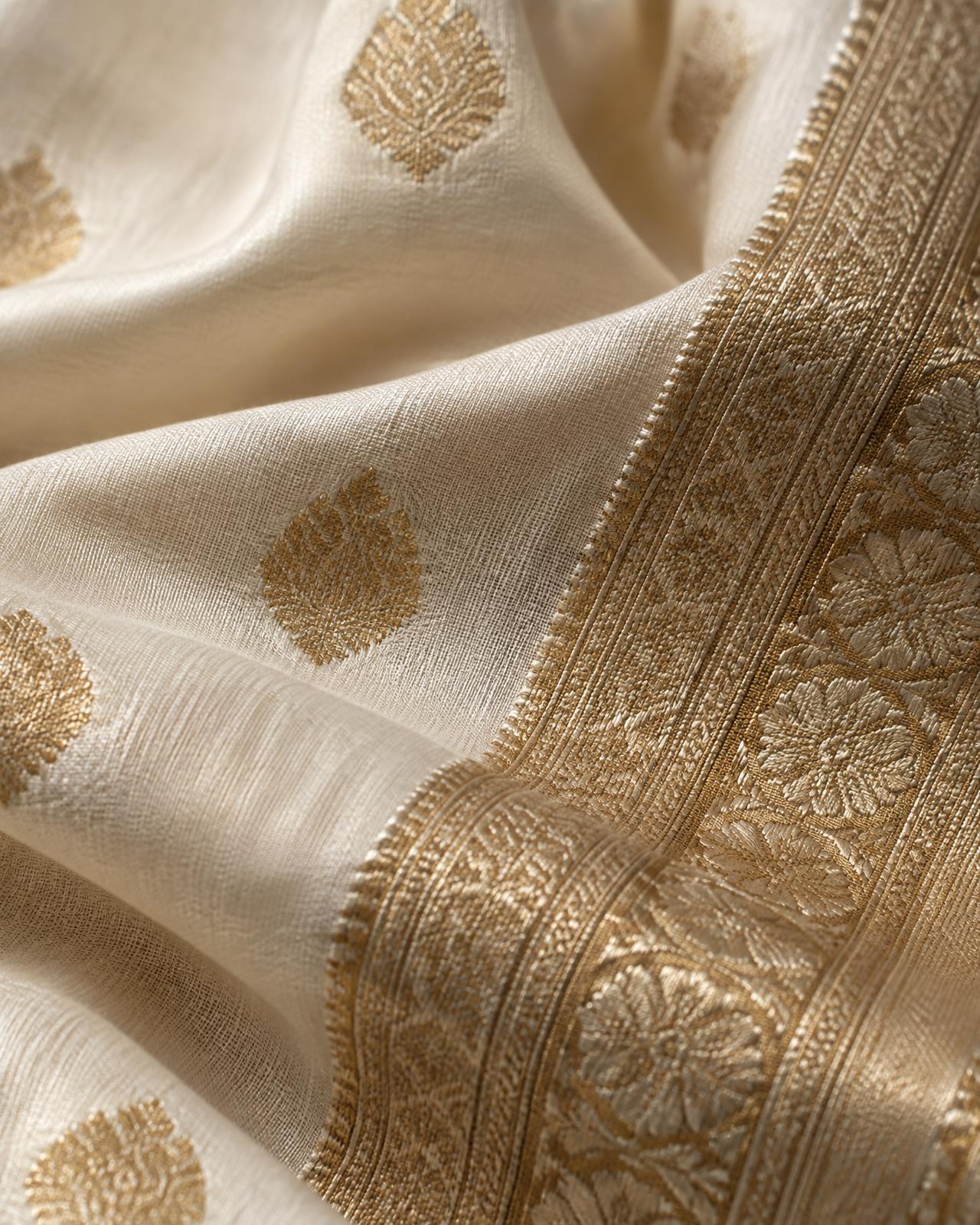 Close-up of ivory silk with a fine antique gold zari border